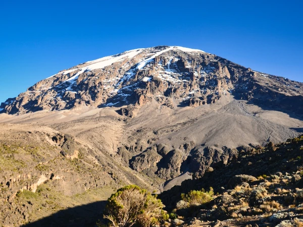 The Snowcapped Uhuru Peak of Kilimanjaro on a clear sunny day perfect for climbing Mount Kilimanjaro