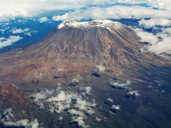 An aerial view of Mt Kilimanjaro with its peak that tourists on Mount Kilimanjaro hike aim to reach