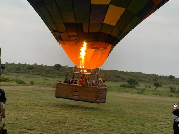 A hot air balloon safari kicking off in the Maasai Mara during a Kenyan safari tour