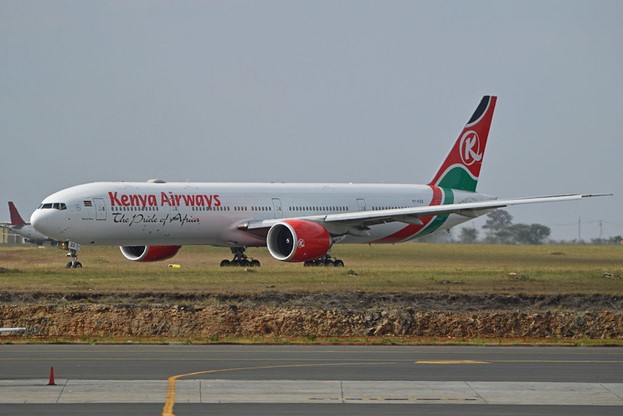 Kenya Airways plane on the runway on a clear sunny day